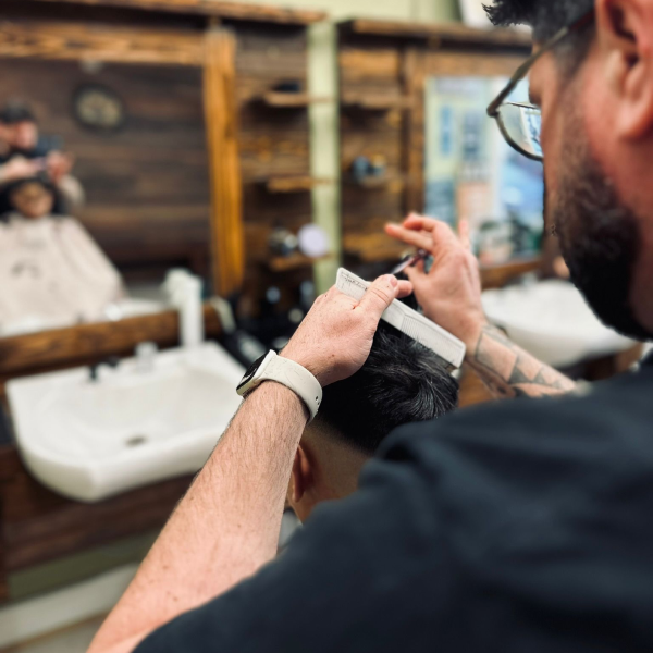 Barber cutting hair